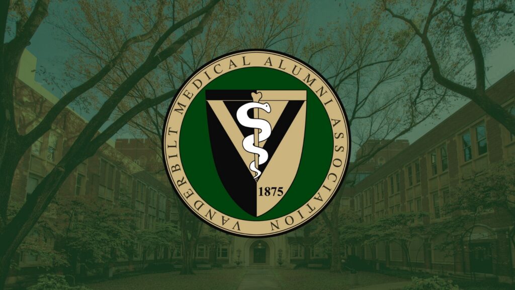 A medical school seal in green and gold sits in front of a photo of a building exterior