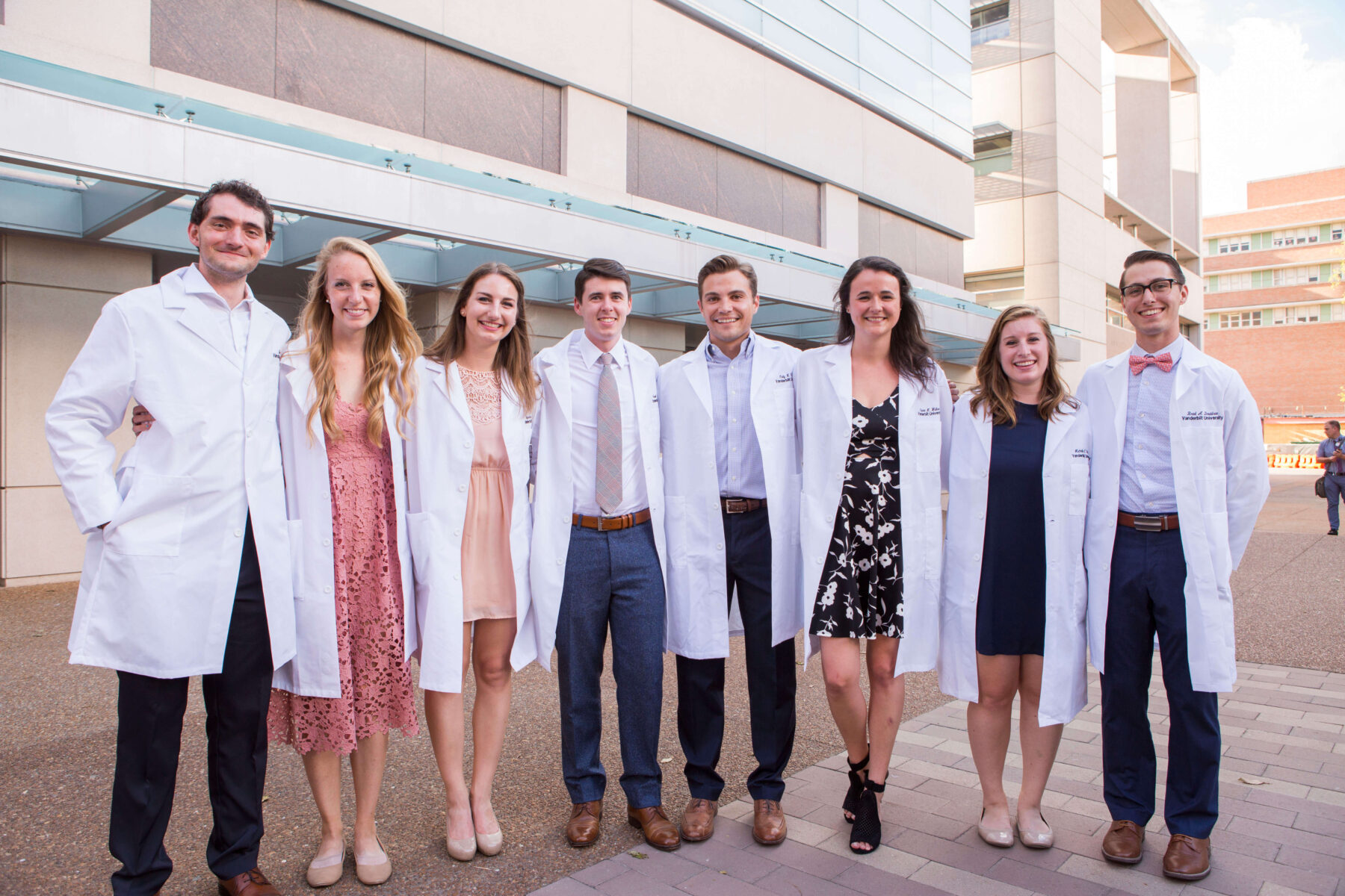 Grad students posing for picture in lab coats