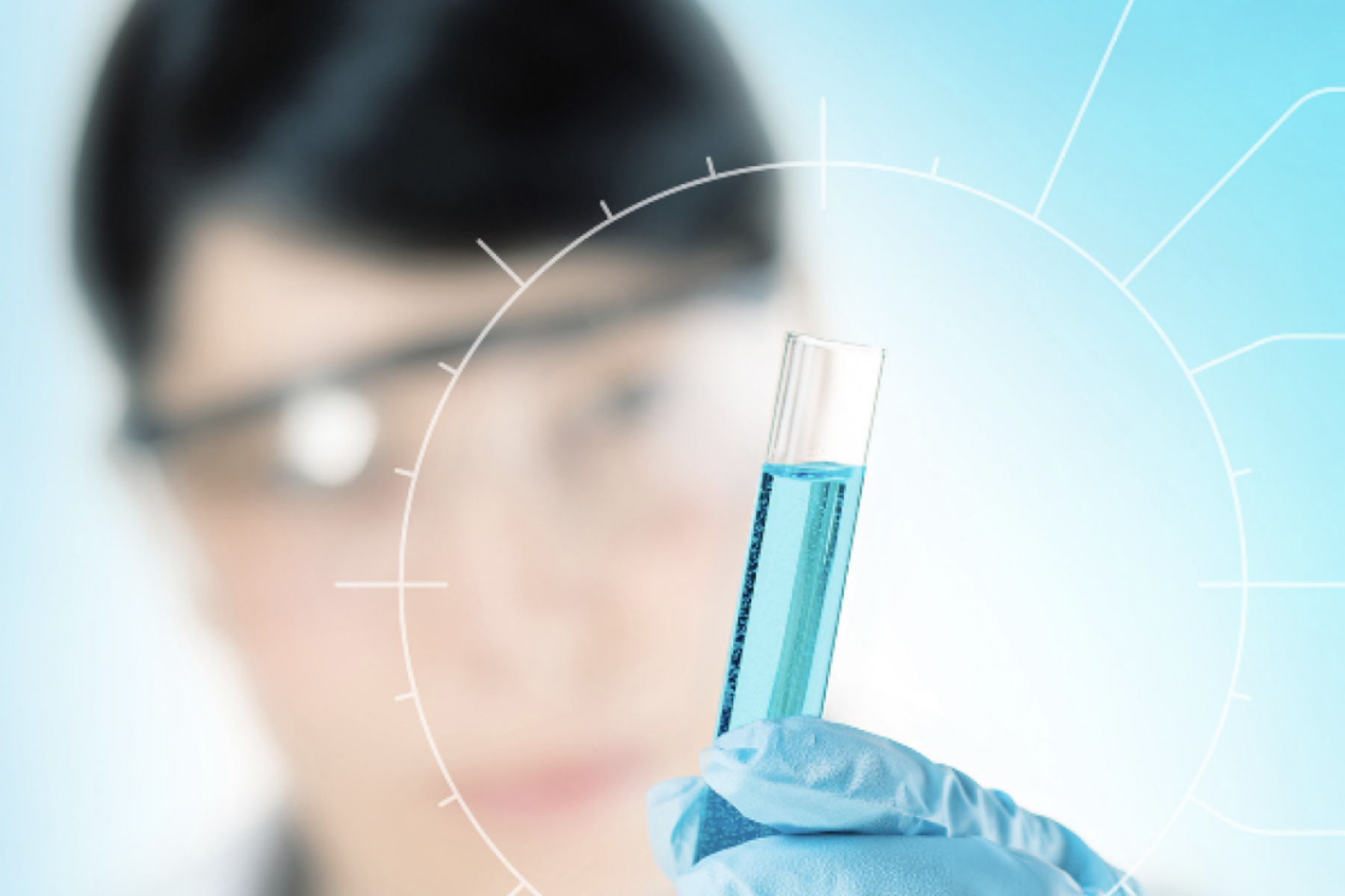 Adobe Stock Image of a lab member holding a test tube.