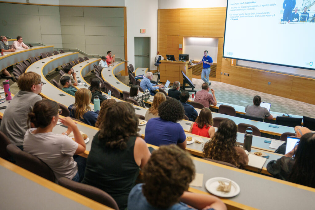 Seminar participants listening to guest speaker Christian Mayr