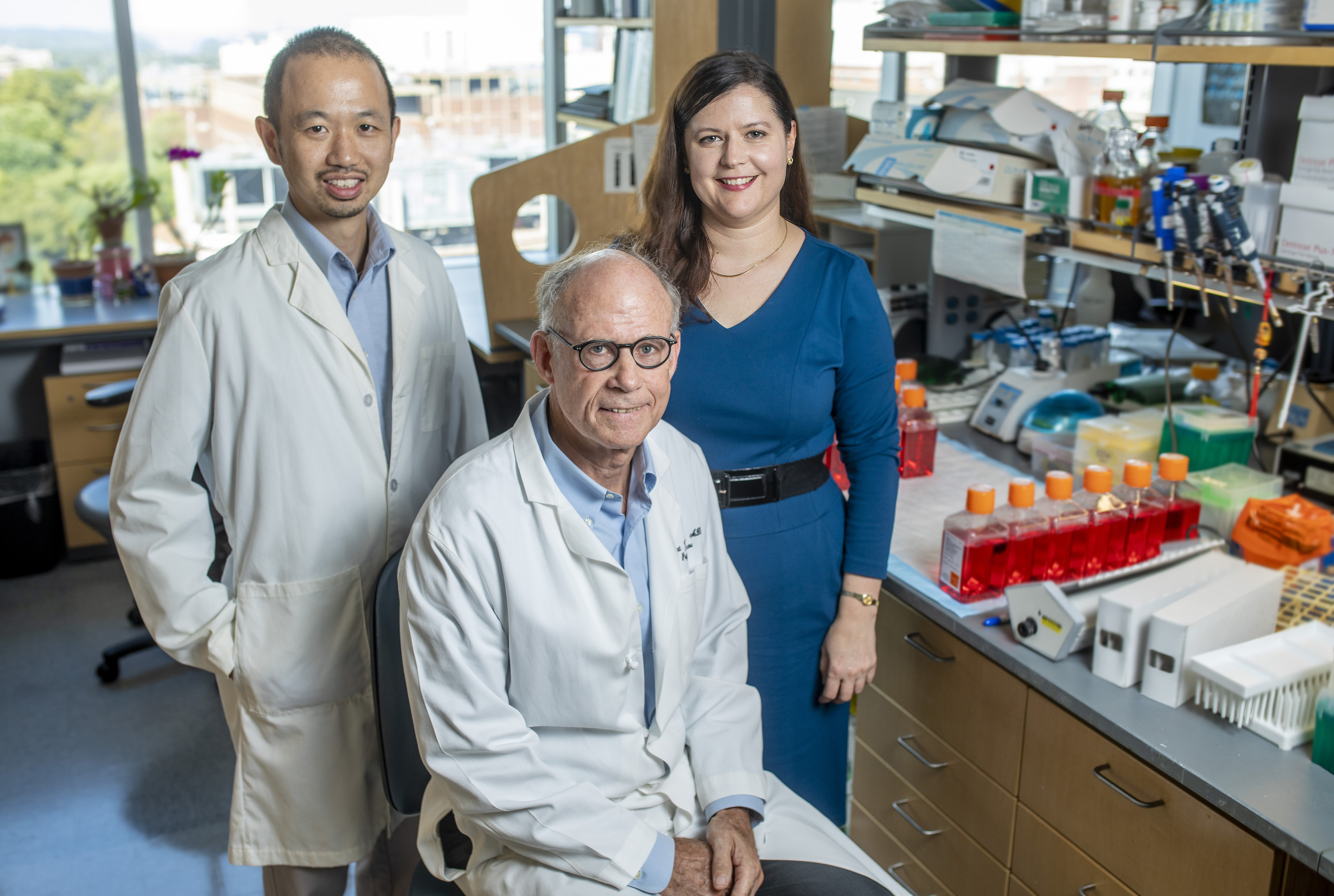 Group photo of (left-to-right) Ken Lau, Robert Coffey, and Martha Shrubsole, in a lab setting.