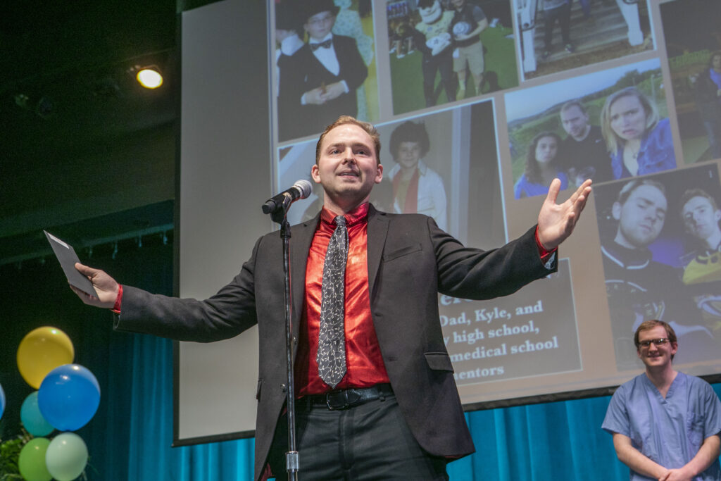 A man speaks into a microphone