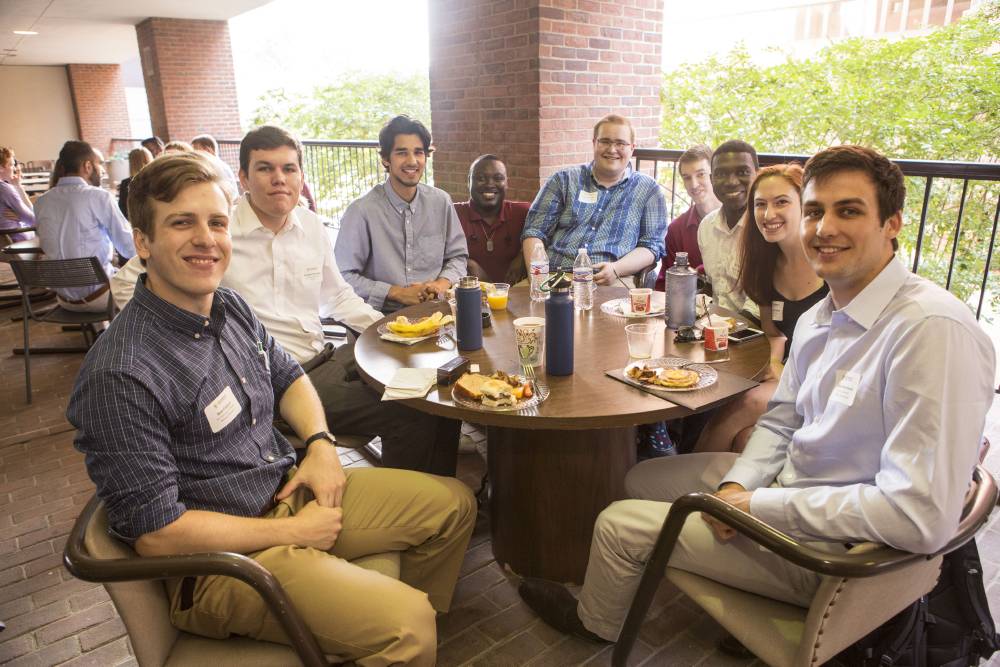 A group of people sit at a table