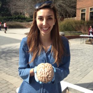 A woman holding a brain