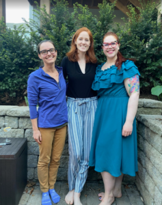 Three women pose for a photo