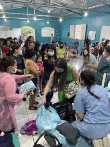 A medical student and her family helps children in Honduras in a brightly colored room