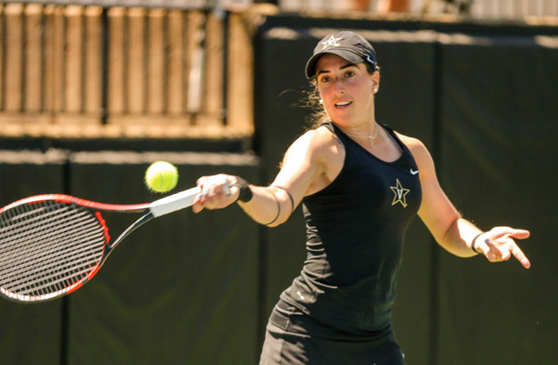 A Vanderbilt women's tennis player hits the ball