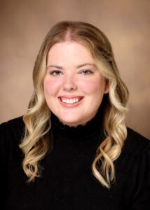 Woman smiles for professional headshot