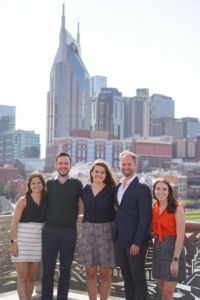 Smith with MGC classmates in front of Nashville skyline