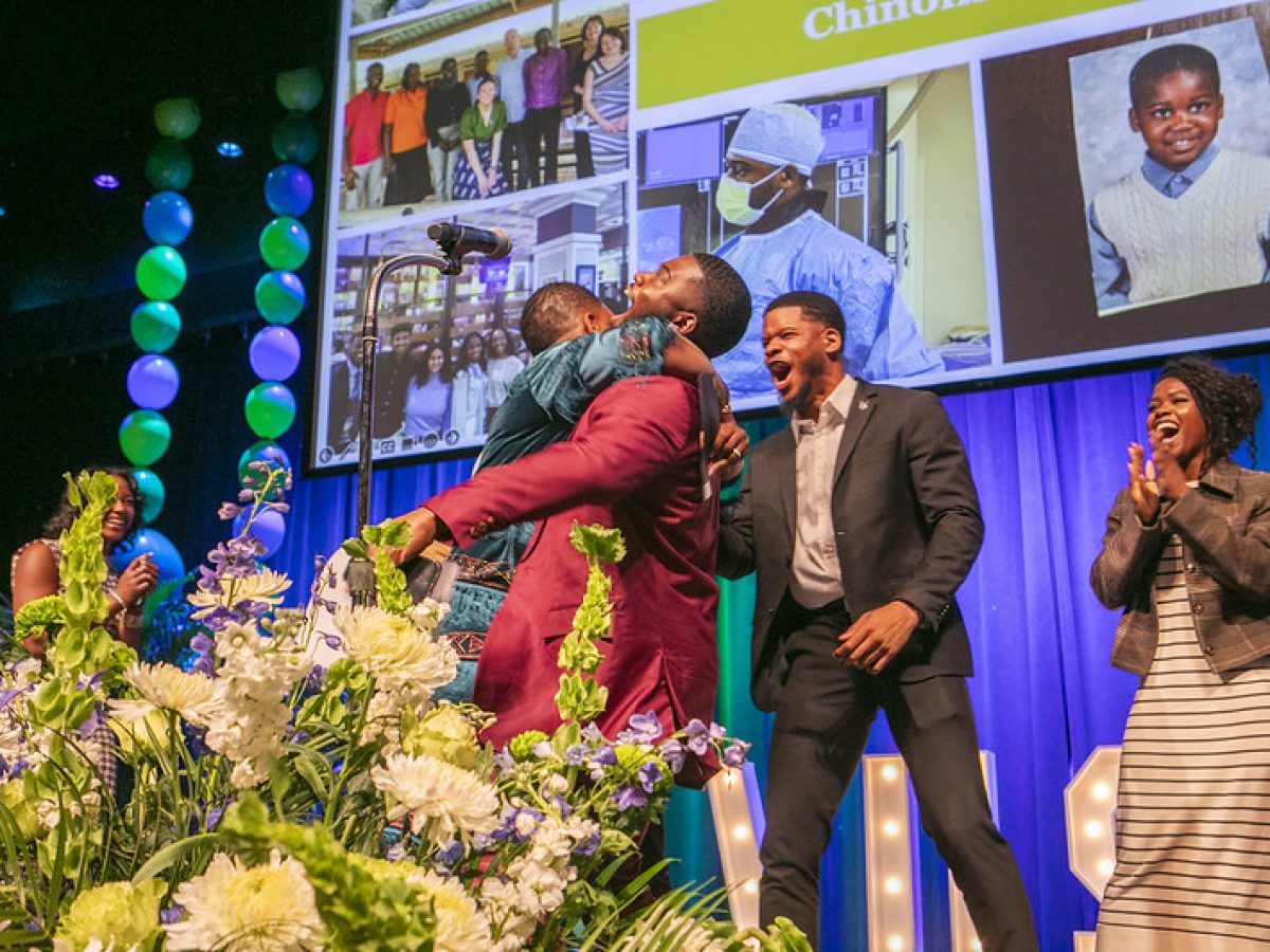 A medical student celebrates and hugs his mother upon learning where he matched for residency.
